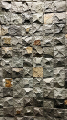 Concrete brick wall background. Relief mosaic wall of small stone cubes. Loft style gray stone texture decorative