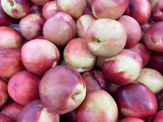 Fresh nectarines at the farmers market, closeup of photo