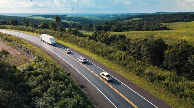 Aerial view of the highway BR277 with cars and trucks moving on it. State of Parana, Brazil