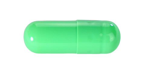 One green capsule pills isolated on white background.
