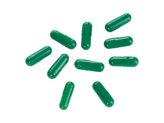 Bulk green capsule pills isolated on white background.