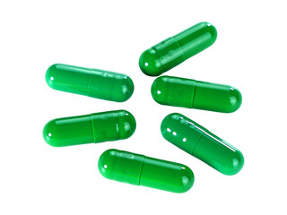 Bulk green capsule pills isolated on white background.