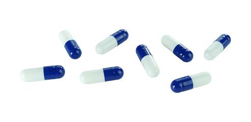 Bulk blue and white capsule pills isolated on white background.