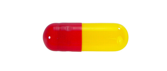 One red and yellow capsule pills isolated on white background.