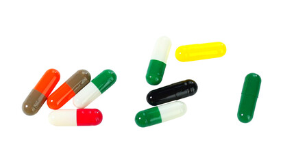 Bulk multi-colored capsule pills isolated on white background.