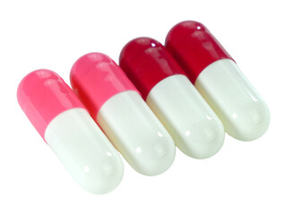 Bulk multi-colored capsule pills isolated on white background.