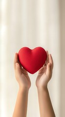 Obraz premium Child's Hands Holding Red Heart for Indoor.