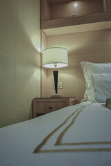 Luxurious interior or inside cabin stateroom on luxury ocean cruiseship or cruise ship liner in...