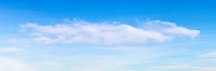 single white cloud in a clear blue sky on a bright day