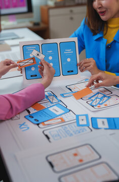 Web designers working on user experience and user interface of mobile application