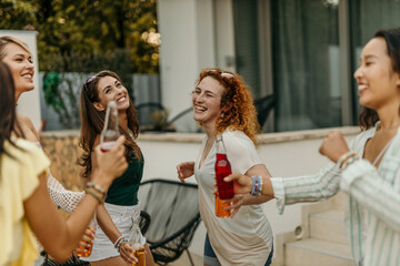 Group of females dancing during a birthday pool party
