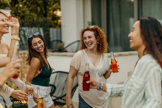 Group of females dancing during a birthday pool party - Powered by Adobe