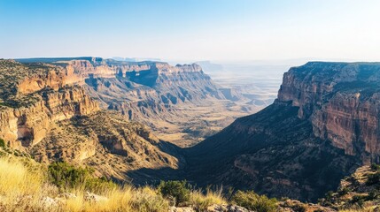 Majestic mountain canyon landscape shows great geological formations under blue sky