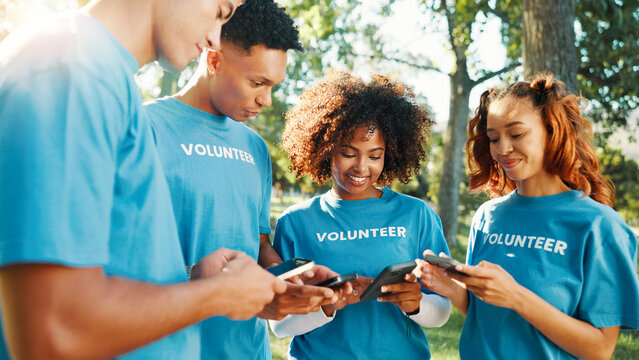 Volunteer group, people and phone at park for global connection, community service chat and NGO website. Non profit organization, smartphone and happy with online coordination or charity event update