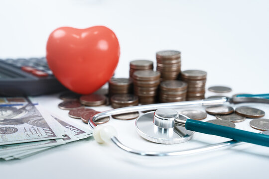 Health care insurance for medical expense concept. stethoscope and money with red heart in hospital. financial management and planning for cost in future. finance and investment in healthcare.
