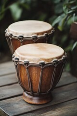 Two wooden drums placed on a wooden table