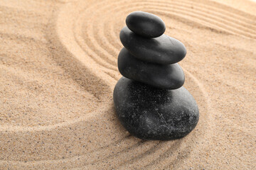 Zen stones in the sand, concept of balance and harmony