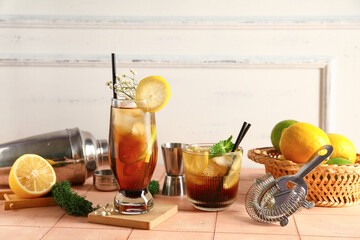 Glasses of cold Long Island iced tea on table