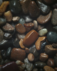 Wet Brown Stones in Overhead View – Natural Texture Background. Stones on the beach