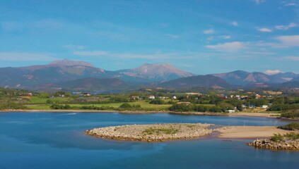 Fototapeta premium Coastal landscape with mountains and a small beach