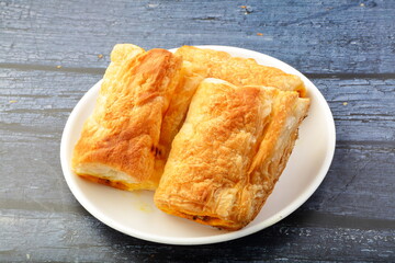Plate of delicious chicken curry puffs.