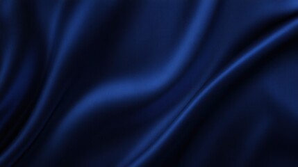 Obraz premium A close-up view of smooth, dark blue fabric, showcasing elegant folds and a lustrous sheen, creating a sense of luxury and sophistication.