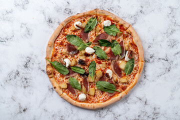 Delight in a beautifully crafted pizza adorned with savory meats, fresh spinach, and creamy cheeses, showcased in an inviting European dining environment