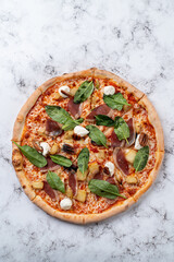Indulging in a beautifully crafted gourmet pizza featuring fresh spinach, prosciutto, and dollops of creamy cheese