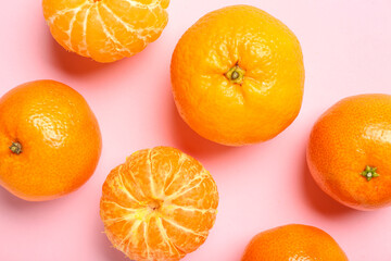 Sweet mandarins on pink background