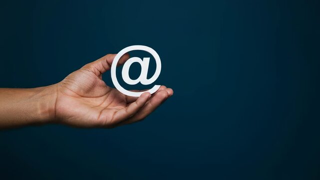 African american man holding at sign cutout against blue. Human hand presentating email, contact us service. Contact information communication motion footage.