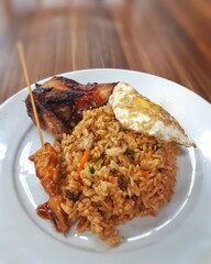 Delicious Indonesian fried rice served with juicy grilled chicken — a perfect combination of flavor and tradition.