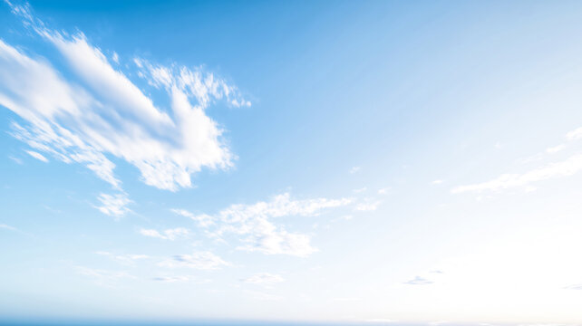 Clear blue sky with a few scattered clouds. day minimalist realistic