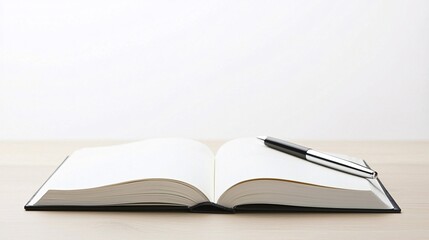 Obraz premium Freshly opened book with a pen beside it, symbolizing the start of a new story