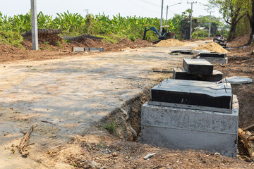 Concrete drainage manhole on construction site. Concrete water tank under construction.