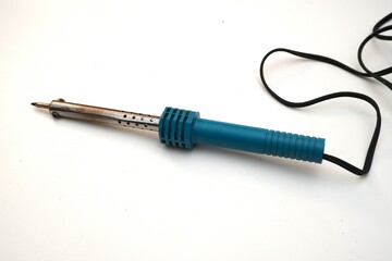 Single soldering iron with a pointed tip, featured alone against a clean white backdrop,...