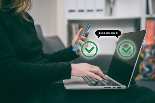 Woman makes an online payment using two-factor authentication. Girl entering a password on laptop while using a smartphone for 2fa verification. Secure online transactions and digital security.