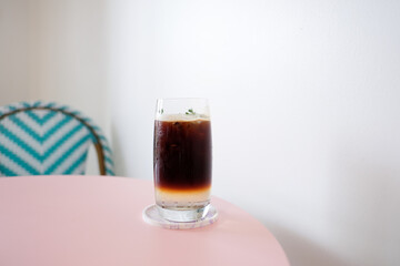 Fresh espresso coffee with coconut juice in coffee cafe.