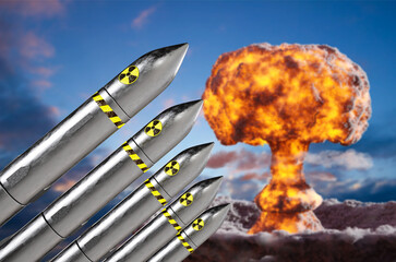 Nuclear missiles with atomic explosion against the sunset sky. Nuclear War concept