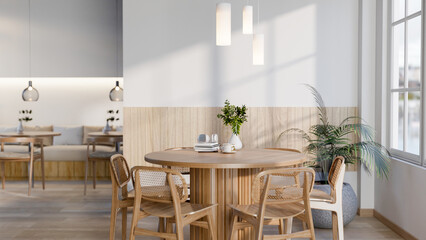 The set of wooden table and chairs next to large glass window in cafe or restaurant. Cosy Interior.