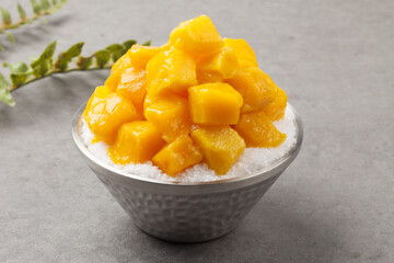 Patbingsu is a food made by crushing ice into small pieces and adding boiled red beans or sugar.