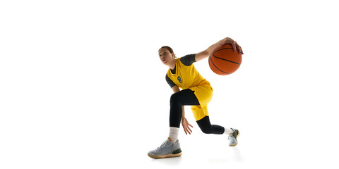 Low angle view of focused woman, basketball player with ball, dribbling, training isolated on white...