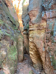 Crevice carved between two ochre cliffs