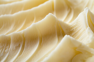 Experience the rich and creamy texture of fresh butter with delicate folds and ridges