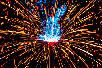 Bright sparks, metal welding, night, energy