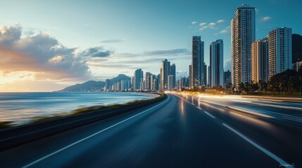 Fototapeta premium Coastal City Highway Sunset: A Stunning View of City Skyline at Dusk