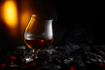 Snifter of brandy on a burning charcoal.