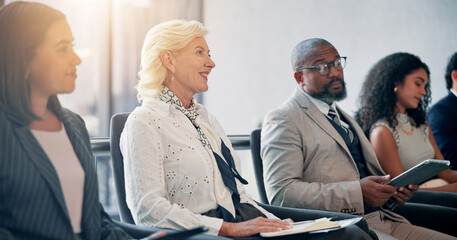 Obraz premium Business, listening and audience in conference, happy and colleagues in workshop for training or meeting. Seminar, information and coworkers with notes for presentation, crowd and people in boardroom