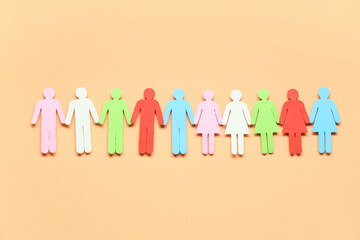 Row of paper human figures on color background. Diversity and inclusion concept