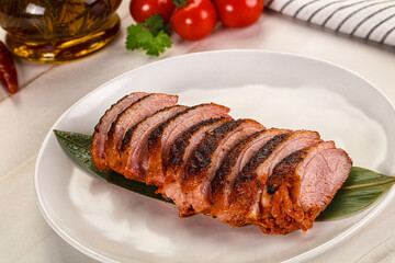 Sliced duck breast baked with cherry