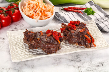 Baked beef cheeks with vegetables